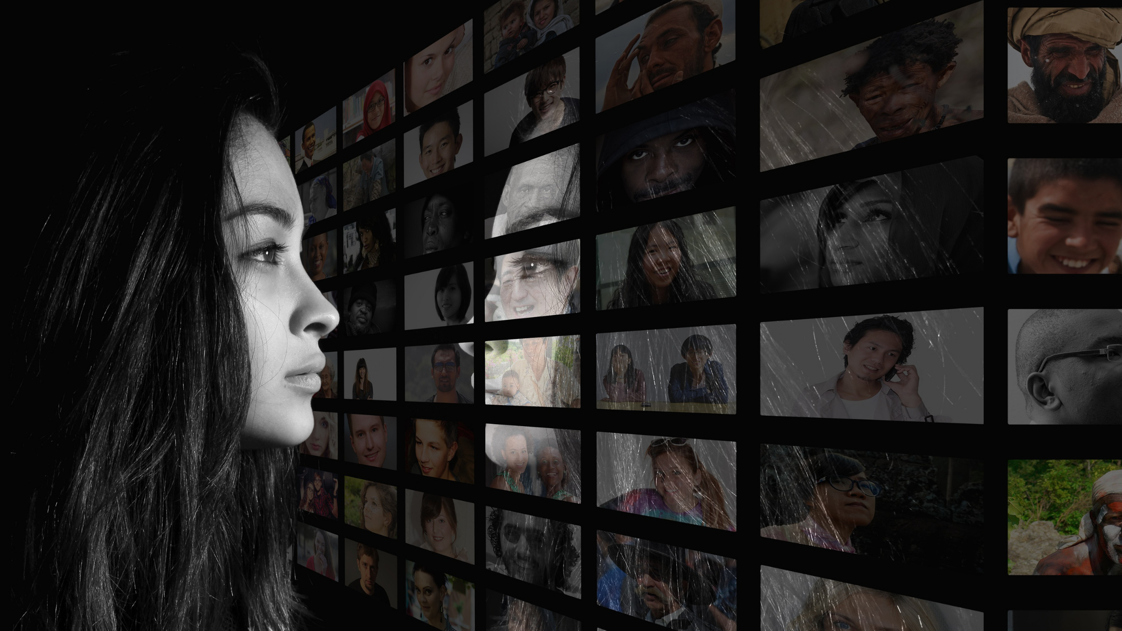 woman looking at screen with diverse representation of faces