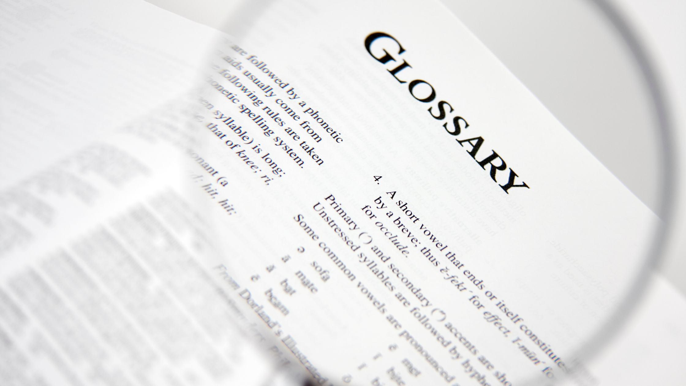 glossary page with magnifying glass on top